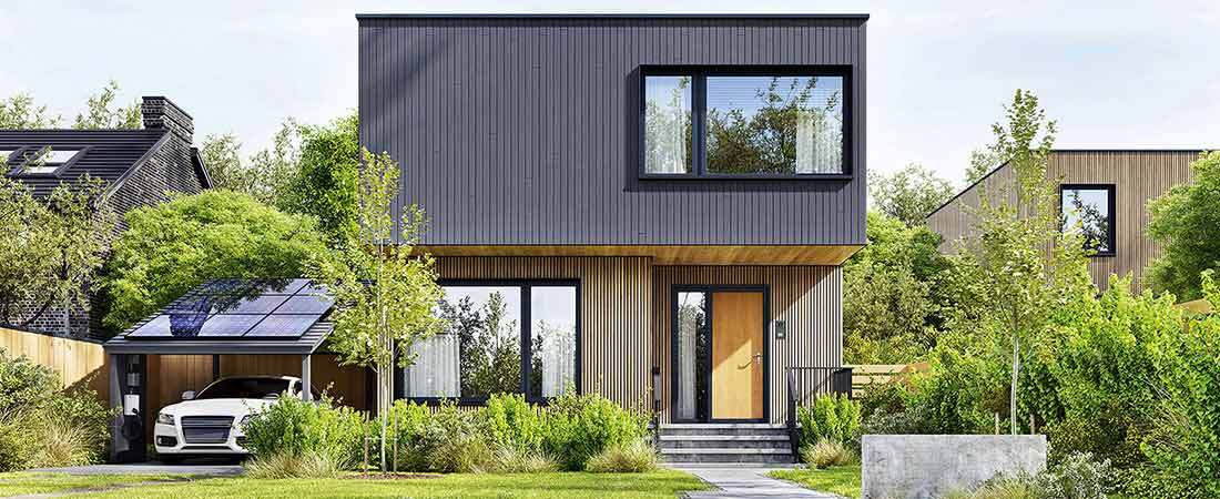 Bild eines Hauses mit Carport welches mit einer PV Anlage ausgestattet ist